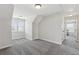 Spacious room with neutral carpet, light grey walls, and natural light from the window at 102 Glenmill Way, Woodstock, GA 30188