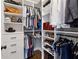 Bright walk-in closet with custom shelves and hanging racks for optimal storage and organization at 102 Glenmill Way, Woodstock, GA 30188