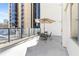 Bright patio with patio furniture, umbrella and city views at 1280 W Peachtree Nw St # 810, Atlanta, GA 30309