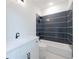 Bathroom featuring a white vanity with a dark countertop and a tiled shower at 158 Palisade Dr, Rydal, GA 30171