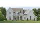 Beautiful two-story home with white siding, manicured lawn and traditional architectural design at 158 Palisade Dr, Rydal, GA 30171