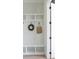 Mudroom with white shelving, hooks, and seating area at 158 Palisade Dr, Rydal, GA 30171