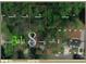 Aerial view of a property showing boundaries, surrounding lots, and landscape in DeKalb County at 3230 Altacrest Dr, Scottdale, GA 30079