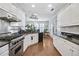 Spacious kitchen featuring stainless steel appliances, granite counters, and a view into the living area at 350 Lockwood Terrace, Decatur, GA 30030