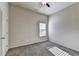 A carpeted bedroom features neutral walls and one window at 830 Pine Arbor Ln, Lawrenceville, GA 30043