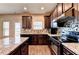 Modern kitchen with granite countertops, stainless steel appliances, and custom cabinetry with wood flooring at 830 Pine Arbor Ln, Lawrenceville, GA 30043