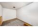 Unfinished basement featuring concrete walls and neutral carpet provides ample space for customization and storage at 307 Adair St # 7-E, Decatur, GA 30030