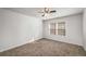 Bedroom featuring carpet flooring, ceiling fan, and large windows for natural light at 307 Adair St # 7-E, Decatur, GA 30030