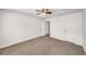 Spacious bedroom with neutral carpeting, ceiling fan, and natural light at 307 Adair St # 7-E, Decatur, GA 30030