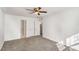 Spacious bedroom with neutral carpet, ceiling fan and ensuite bathroom at 307 Adair St # 7-E, Decatur, GA 30030