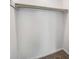 Walk-in closet featuring carpeted floors, white walls, and a clothing rod for easy organizing at 307 Adair St # 7-E, Decatur, GA 30030