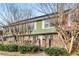 Charming two-story townhouse featuring a brick facade, landscaped front yard, and inviting entrance at 307 Adair St # 7-E, Decatur, GA 30030