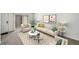 A living room featuring neutral decor, large windows, and stylish furniture at 307 Adair St # 7-E, Decatur, GA 30030