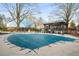 Community pool is covered for the winter, with a pergola, seating area, and mature trees offering a relaxing outdoor space at 307 Adair St # 7-E, Decatur, GA 30030