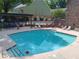 Outdoor community pool featuring lounge chairs and tables, great for relaxing at 307 Adair St # 7-E, Decatur, GA 30030