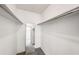 Walk-in closet featuring carpeted floors, white walls, and shelving for optimal storage at 307 Adair St # 7-E, Decatur, GA 30030
