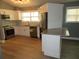 Modern kitchen with stainless steel appliances, granite countertops, and a breakfast bar at 6832 Shangrila Way, Riverdale, GA 30296