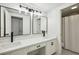 Bathroom featuring double sinks, modern lighting, and a separate shower area at 2106 Clairmeade Valley Ne Rd, Atlanta, GA 30329