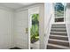 Bright entryway with white walls and a carpeted staircase at 2106 Clairmeade Valley Ne Rd, Atlanta, GA 30329