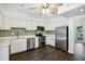 Well-lit kitchen with stainless steel appliances and a tile backsplash at 2106 Clairmeade Valley Ne Rd, Atlanta, GA 30329