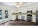 Open-concept kitchen featuring stainless appliances and an adjacent dining area at 2106 Clairmeade Valley Ne Rd, Atlanta, GA 30329