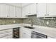 Close-up of a kitchen sink area with quartz counters and modern fixtures at 2106 Clairmeade Valley Ne Rd, Atlanta, GA 30329