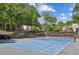 Community tennis court surrounded by mature trees, offering a recreational amenity at 2106 Clairmeade Valley Ne Rd, Atlanta, GA 30329