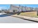 Exterior backyard view of the house showing the lawn and back of the building at 3158 Onamia Rd, Duluth, GA 30096