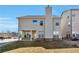 Exterior view of home showcasing a backyard, chimney and a covered patio at 3158 Onamia Rd, Duluth, GA 30096