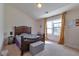 Cozy bedroom with a large window, natural light, carpeting, and neutral tones at 3158 Onamia Rd, Duluth, GA 30096