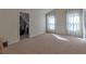 Spacious bedroom with natural light from two windows and ample closet space at 3158 Onamia Rd, Duluth, GA 30096