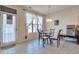 Bright breakfast area with glass table, tile floor, and natural light from a sliding glass door at 3158 Onamia Rd, Duluth, GA 30096