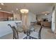 Breakfast area with a round glass table, pendant lighting, and an open kitchen view at 3158 Onamia Rd, Duluth, GA 30096