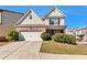 Charming two-story home with a manicured lawn and attached two car garage at 3158 Onamia Rd, Duluth, GA 30096