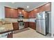 Well-equipped kitchen with stainless steel appliances, granite countertops, and tiled backsplash at 3158 Onamia Rd, Duluth, GA 30096