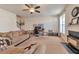 Spacious living room featuring fireplace, carpeting, neutral tones, and work space with plenty of natural light at 3158 Onamia Rd, Duluth, GA 30096