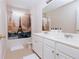 Bathroom with a double sink vanity, a Paris-themed shower curtain, and a large mirror at 4617 Stone Lane, Stone Mountain, GA 30083