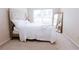 Neutral bedroom with carpet, large window for light, neutral colors and a mirror at 4617 Stone Lane, Stone Mountain, GA 30083