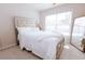 Cozy bedroom featuring a large window, neutral walls, carpet flooring and a large mirror at 4617 Stone Lane, Stone Mountain, GA 30083