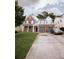 Charming two-story home featuring brick accents, white siding, a well-manicured lawn, and an attached two-car garage at 4617 Stone Lane, Stone Mountain, GA 30083