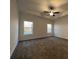 This bedroom has neutral walls, carpeted floors and lots of natural light from the two large windows at 554 Presley Farm Parkway, Rockmart, GA 30153