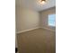 Neutral bedroom featuring carpeted floors, neutral paint and natural light from the window at 554 Presley Farm Parkway, Rockmart, GA 30153