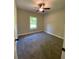 Bedroom features neutral walls, carpeting, a ceiling fan, and a window for natural light at 554 Presley Farm Parkway, Rockmart, GA 30153