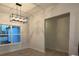 Bright dining area with picture window and modern light fixture at 554 Presley Farm Parkway, Rockmart, GA 30153