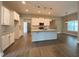 Well-lit kitchen area featuring a center island with pendant lights and stainless steel appliances at 554 Presley Farm Parkway, Rockmart, GA 30153