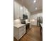 Well-lit kitchen with white cabinets, stainless steel appliances and granite countertops at 554 Presley Farm Parkway, Rockmart, GA 30153