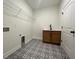 Laundry room featuring patterned floors, cabinet and folding rack at 554 Presley Farm Parkway, Rockmart, GA 30153