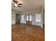 An airy living room showcases hardwood floors, multiple windows, and a ceiling fan at 554 Presley Farm Parkway, Rockmart, GA 30153