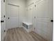 Mud room features storage bench and hooks at 554 Presley Farm Parkway, Rockmart, GA 30153