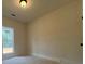This is a light and airy bedroom with a window and a light on the ceiling at 554 Presley Farm Pkwy, Rockmart, GA 30153